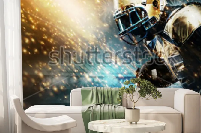 Fototapeta: American football sportsman player on stadium running in action.