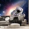 Fototapeta: Astronauta w kosmosie na tle galaktyki