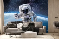 Fototapeta: Astronauta w przestrzeni kosmicznej z panoramą ziemi