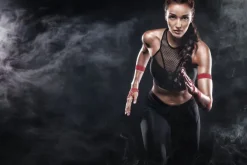 Fototapeta: Atletyczna kobieta podczas biegania