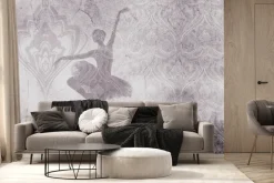 Fototapeta: Baletnica w ruchu na tle betonu z ozdobnymi ornamentami