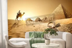 Fototapeta: Beduin na wielbłądzie niedaleko piramid i ankh w pustyni