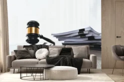 Fototapeta: Black wooden gavel hammer and legal document in empty law firm