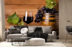 Fototapeta: Calice di vino rosso con uva e botte