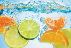 Fototapeta: Cytryny i pomarańcze wpadające do wody