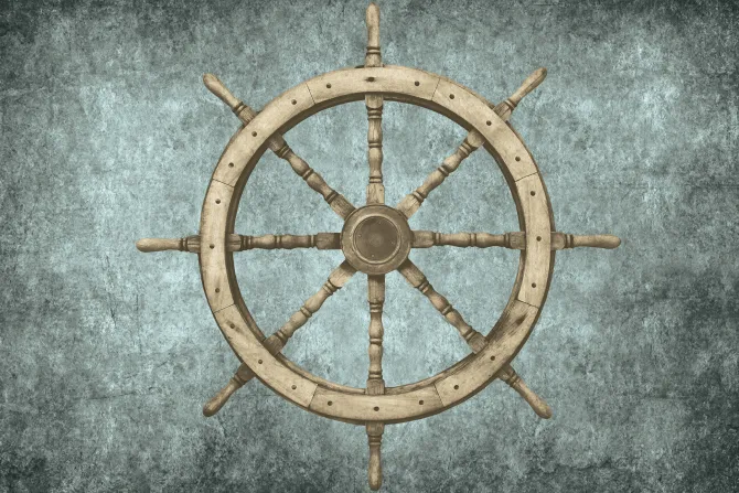 Fototapeta: Drewniany ster statku na betonowym tle