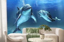 Fototapeta: Dwa delfiny pływające w błękitnej wodzie