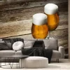 Fototapeta: Dwie szklanki do piwa na tle drewna z copyspace