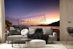 Fototapeta: Fale na skalistym brzegu w zachodzie słońca