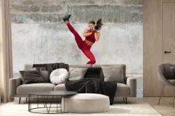 Fototapeta: Fitness girl kicking. full-length portrait of sporty woman with