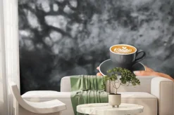 Fototapeta: Gray cup of fresh cappuccino in woman hands on background of