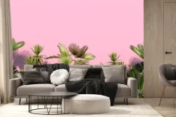 Fototapeta: Green palm trees and tropical exotic plants on a pink background