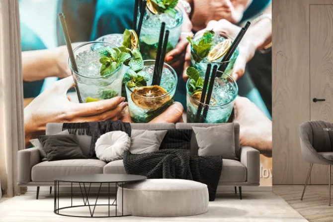 Fototapeta: Happy friends group cheering mojito drinks at fancy bar restaurant