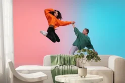 Fototapeta: In jump. boy and girl dancing hip-hop in stylish clothes on colorful