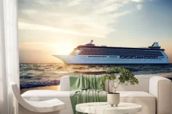 Fototapeta: Jacht na morzu na tle zachodzącego słońca