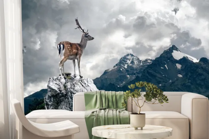 Fototapeta: Jeleń stojący na skale na tle chmur