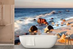 Fototapeta: Kamienie na plaży o zachodzie słońca