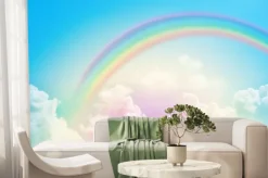 Fototapeta: Kolorowa tęcza nad chmurami na błękitnym niebie
