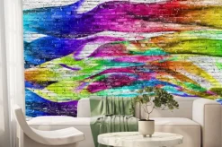 Fototapeta: Kolorowe fale namalowane na ścianie z cegły