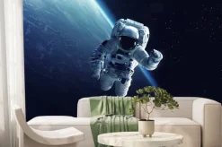 Fototapeta: Kosmonauta na tle ziemi