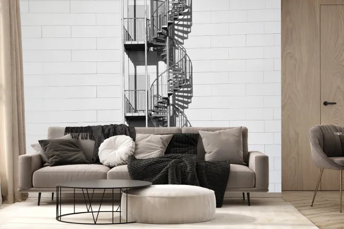 Fototapeta: Kręcone schody na białej ceglanej ścianie