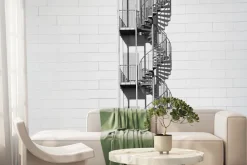 Fototapeta: Kręcone schody na białej ceglanej ścianie