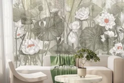 Fototapeta: Kwiaty białych lilii wśród zielonych liści