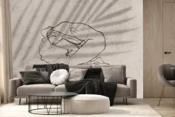 Fototapeta: Leżąca kobieta na tle liścia palmowego