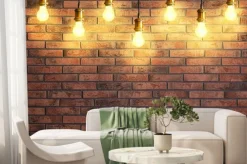 Fototapeta: Many pendant lamps against red brick wall