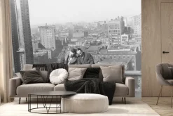 Fototapeta: Mężczyźni na metalowej konstrukcji na tle miasta