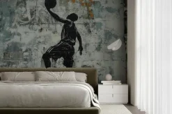 Fototapeta: Mężczyzna koszykarz z piłka na murze