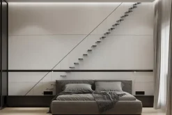 Fototapeta: Metalowe delikatne schody przy białej ścianie