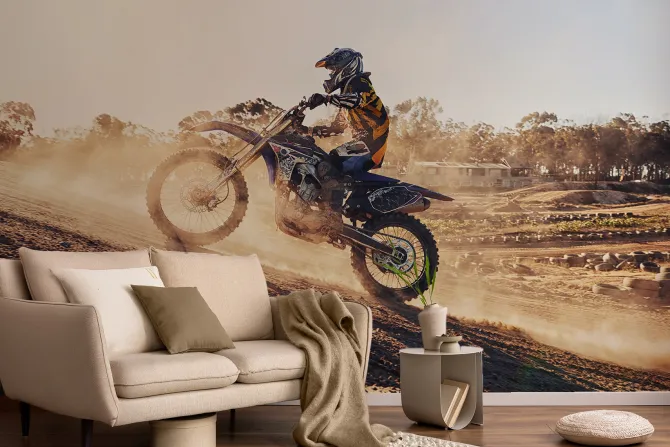 Fototapeta: Motocyklista jadący po wzgórzu