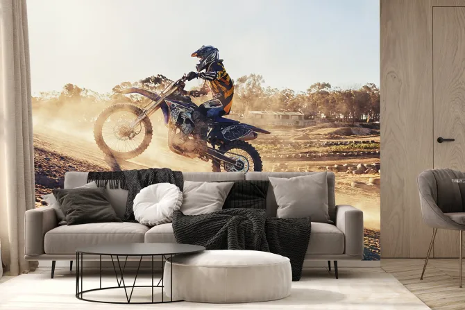 Fototapeta: Motocyklista jadący po wzgórzu