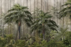 Fototapeta: Palmy i tropikalna zieleń na tle drewnianych desek
