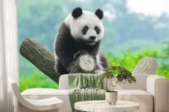 Fototapeta: Panda siedząca na gałęzi w zielonym lesie