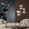 Fototapeta: Passionate guitarist jumps in the air over black