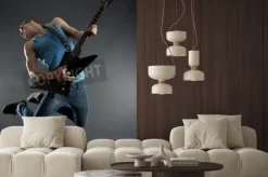 Fototapeta: Passionate guitarist jumps in the air over black