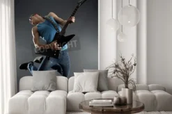 Fototapeta: Passionate guitarist jumps in the air over black