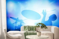 Fototapeta: Perkusista gra na perkusji na koncert muzyczny. klub światła