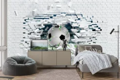 Fototapeta: Piłka nożna przebijająca ceglany mur