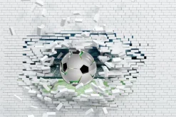 Fototapeta: Piłka nożna przebijająca ceglany mur