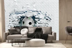 Fototapeta: Piłka nożna przebijająca ceglany mur