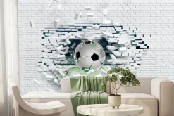 Fototapeta: Piłka nożna przebijająca ceglany mur