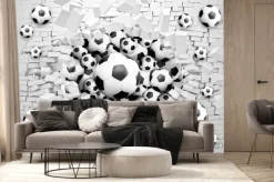Fototapeta: Piłki nożne przebijające ceglany mur 3d