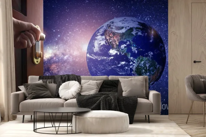 Fototapeta: Ręka otwiera drzwi do pustego pokoju planeta ziemia z kosmosu.