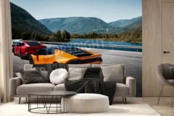 Fototapeta: Samochody sportowe na moście z widokiem na rzekę i góry