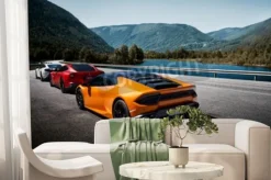 Fototapeta: Samochody sportowe na moście z widokiem na rzekę i góry