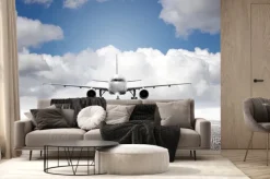 Fototapeta: Samolot startujący z pasa na tle chmur