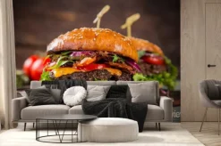 Fototapeta: Smaczne hamburgery na drewnianym stole.